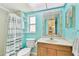 Bright bathroom with a framed mirror, a toilet, open shelving, and a striped shower curtain at 12306 91St Ter, Seminole, FL 33772