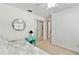 Bright bedroom featuring a ceiling fan, mirror, closet, and side table with storage at 12306 91St Ter, Seminole, FL 33772