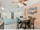 Elegant dining area featuring a dark wood table and stylish lighting at 12306 91St Ter, Seminole, FL 33772