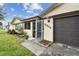 Inviting front entrance with a security gate and manicured landscaping at 12306 91St Ter, Seminole, FL 33772
