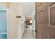 Welcoming hallway with wood-look floors leading to the living spaces at 12306 91St Ter, Seminole, FL 33772
