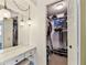 Well-organized walk-in closet with shelving, and a vanity with Hollywood-style lighting, providing ample storage at 12306 91St Ter, Seminole, FL 33772