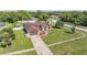 Inviting single-Gathering home features a well-manicured lawn and an attached two-car garage at 13386 Lawrence St, Spring Hill, FL 34609
