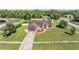 Attractive single-story home with landscaping, a driveway, and a well-maintained front lawn at 13386 Lawrence St, Spring Hill, FL 34609