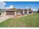 Charming single-story home with a well-manicured lawn, stone accents, and a two-car garage at 13386 Lawrence St, Spring Hill, FL 34609