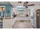 Bright kitchen features stainless steel appliances, granite countertops, wood-look tile, and ample cabinetry at 13386 Lawrence St, Spring Hill, FL 34609