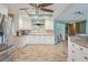 Bright kitchen boasts granite countertops, stainless appliances, wood-look tile, and abundant storage at 13386 Lawrence St, Spring Hill, FL 34609