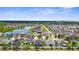 A vibrant aerial view shows a community with picturesque ponds and lush green spaces at 13913 Felix Will Rd, Riverview, FL 33579