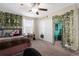 Bedroom with closet and decorated with wall vines, bed, and desk at 13913 Felix Will Rd, Riverview, FL 33579