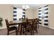 Formal dining room features modern lighting and table with seating for six at 13913 Felix Will Rd, Riverview, FL 33579