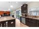 Modern kitchen with granite countertops, stainless steel appliances, and tile backsplash at 13913 Felix Will Rd, Riverview, FL 33579