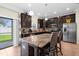 Well-equipped kitchen features granite countertops, stainless steel appliances, and a center island at 13913 Felix Will Rd, Riverview, FL 33579