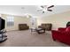 Bright living room featuring neutral walls, two sofas, and large windows at 13913 Felix Will Rd, Riverview, FL 33579
