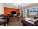 Spacious living room features modern furniture, wood flooring, and sliding glass doors leading to the patio at 13913 Felix Will Rd, Riverview, FL 33579