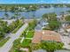 Aerial view of house with waterfront streetscape and lush tropical landscaping at 146 26Th Ne Ave, St Petersburg, FL 33704