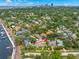 Expansive aerial view of neighborhood with waterway, trees, and surrounding cityscape at 146 26Th Ne Ave, St Petersburg, FL 33704