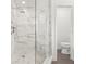 Modern bathroom featuring marble tile shower with glass door and rainfall shower head at 146 26Th Ne Ave, St Petersburg, FL 33704