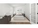 Bright bedroom features light walls, wood floors, minimalist decor, and a plush rug for a serene atmosphere at 146 26Th Ne Ave, St Petersburg, FL 33704