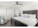 Bright bedroom featuring a ceiling fan, closet, and a beautifully styled wooden bed frame at 146 26Th Ne Ave, St Petersburg, FL 33704