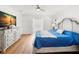 Brightly lit bedroom featuring hard wood floors, and a bed with wooden headboard at 146 26Th Ne Ave, St Petersburg, FL 33704