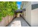 Long driveway of home with decorative pavers and a black awning alongside the house at 146 26Th Ne Ave, St Petersburg, FL 33704
