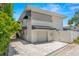 View of home's exterior, showcasing the garage, driveway, and adjacent landscaping at 146 26Th Ne Ave, St Petersburg, FL 33704