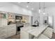 Modern kitchen featuring stainless steel appliances, custom cabinets, and a marble countertop at 146 26Th Ne Ave, St Petersburg, FL 33704