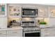 Close-up of stainless steel appliances and marble backsplash in a well-appointed kitchen at 146 26Th Ne Ave, St Petersburg, FL 33704