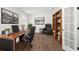 Well-appointed home office with wood floors, built-in bookshelves, and modern decor at 146 26Th Ne Ave, St Petersburg, FL 33704