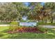 Charming park entrance with attractive sign, landscaping, and mature trees at 146 26Th Ne Ave, St Petersburg, FL 33704