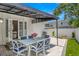 Covered patio with an outdoor dining area, perfect for entertaining and relaxation at 146 26Th Ne Ave, St Petersburg, FL 33704