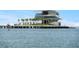 Modern waterfront pier featuring dining and recreational spaces, set against a serene sea under a clear sky at 146 26Th Ne Ave, St Petersburg, FL 33704