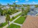 Charming street view with lush greenery and glimpses of waterfront property at 146 26Th Ne Ave, St Petersburg, FL 33704