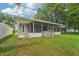 Well-maintained backyard with a screened porch, perfect for outdoor entertaining at 1502 Marsh Wood Dr, Seffner, FL 33584