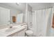 Clean bathroom featuring a shower, toilet, vanity, and a large mirror at 1502 Marsh Wood Dr, Seffner, FL 33584