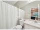 Bright bathroom with a shower, tub, and large mirror reflecting the bedroom at 1502 Marsh Wood Dr, Seffner, FL 33584