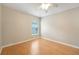 An empty bedroom showcasing the flooring, window, and simple design at 1502 Marsh Wood Dr, Seffner, FL 33584