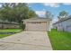 Charming single-story home with a spacious driveway, two-car garage, and manicured lawn at 1502 Marsh Wood Dr, Seffner, FL 33584