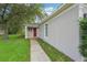 Charming single-story home featuring a stucco facade and a walkway to the front door at 1502 Marsh Wood Dr, Seffner, FL 33584