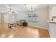 Inviting living room features neutral paint, wood floors, and large window at 1502 Marsh Wood Dr, Seffner, FL 33584