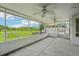 Large screened porch overlooking backyard offers space for outdoor living and relaxation at 1502 Marsh Wood Dr, Seffner, FL 33584