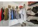 Organized walk-in closet with shelves and hanging storage for clothes and accessories at 1502 Marsh Wood Dr, Seffner, FL 33584