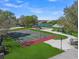 Outdoor basketball court with playground, picnic pavilion, and lake in a well-maintained community at 15415 Mulholland Rd, Parrish, FL 34219