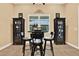 Dining area with wood table, chairs, and natural light at 15415 Mulholland Rd, Parrish, FL 34219
