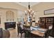 Dining room with wood table and chairs with neutral colored walls at 15415 Mulholland Rd, Parrish, FL 34219
