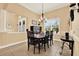 Formal dining room with dark wood table, neutral walls and tiled floors at 15415 Mulholland Rd, Parrish, FL 34219