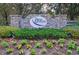 Welcoming community entrance sign surrounded by lush greenery and manicured landscaping at 15415 Mulholland Rd, Parrish, FL 34219