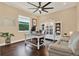 Inviting home office with built-in shelving, a bright window, and comfortable seating at 15415 Mulholland Rd, Parrish, FL 34219