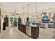 Spacious kitchen with large island, stainless steel appliances, and open floor plan at 15415 Mulholland Rd, Parrish, FL 34219