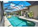 Spacious screened-in pool area perfect for entertaining, featuring ample seating and outdoor amenities at 15415 Mulholland Rd, Parrish, FL 34219